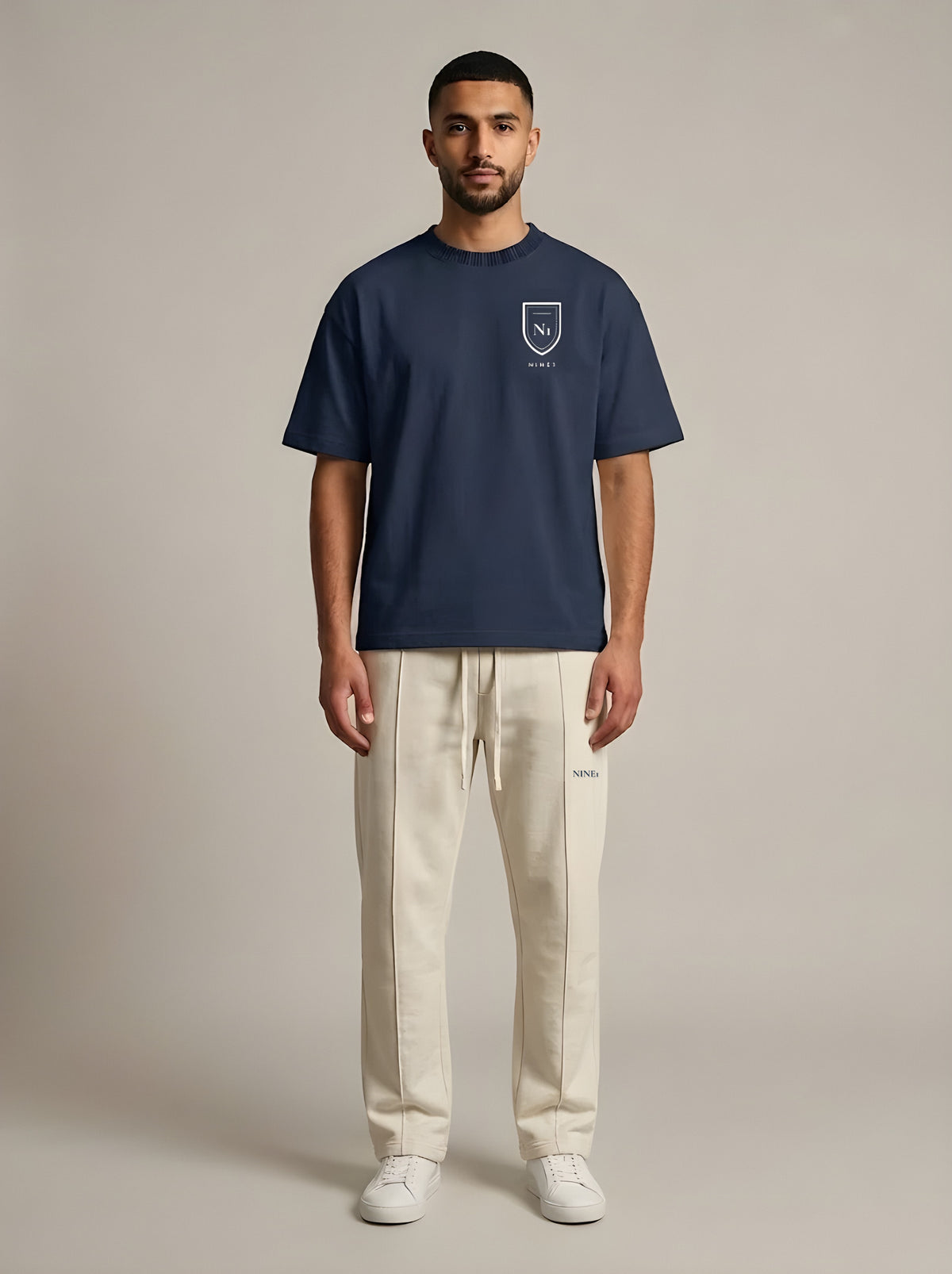 Model wearing the NINE1 Crest Tee (N1T01) with the Crest Jogger (N1J01)