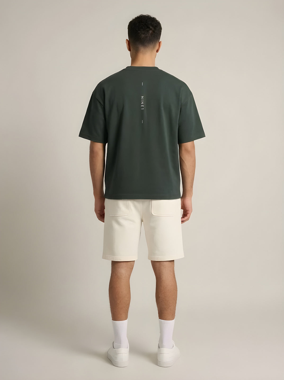 NINE1 Spine Tee (N1T07), back view with the spine line