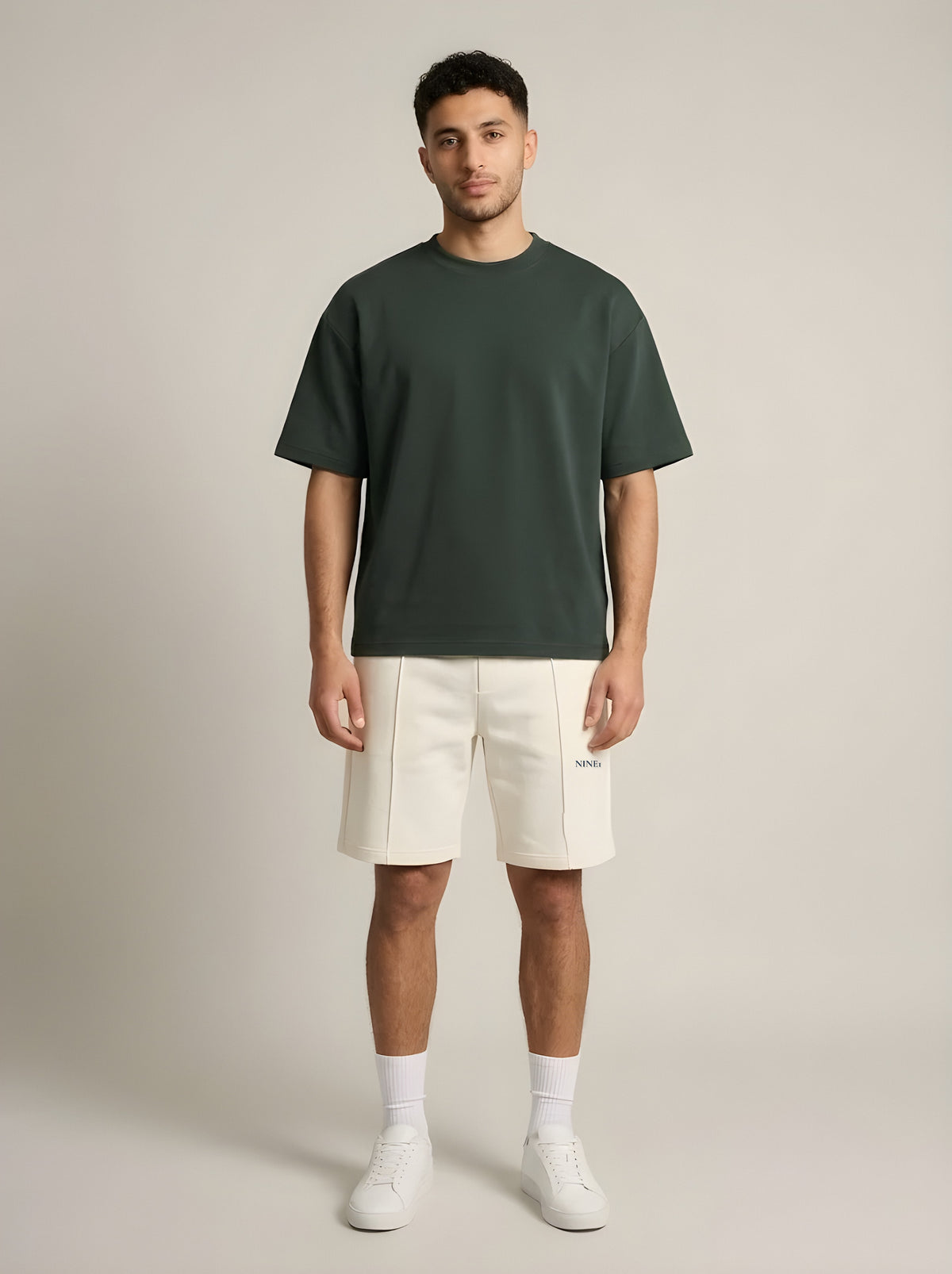 Model wearing the NINE1 Spine Shorts (N1S07) with the Spine Tee (N1T07)