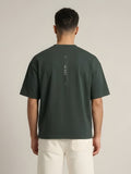 NINE1 Spine Oversized Tee in Dark Green (N1T07), back view showing the spine print