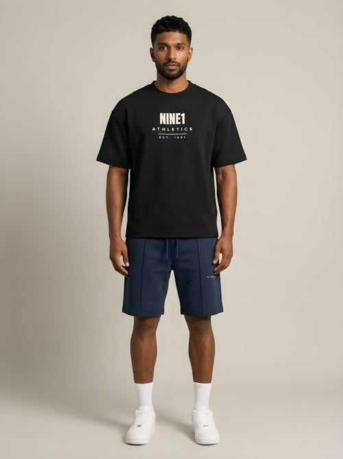 Model wearing the NINE1 Athletics Shorts (N1S11) with the Athletics Tee (N1T11)
