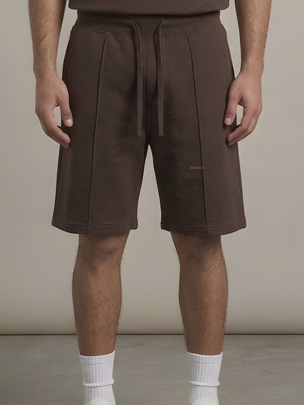 Contour Shorts in Chocolate, N1S20, tonal NINE1 micro wordmark at the leg