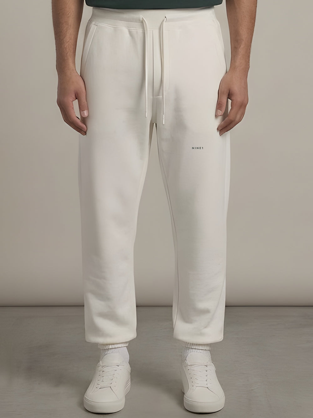 Gallery Open-Hem Jogger in Off White, N1J21, NINE1 micro wordmark at the leg