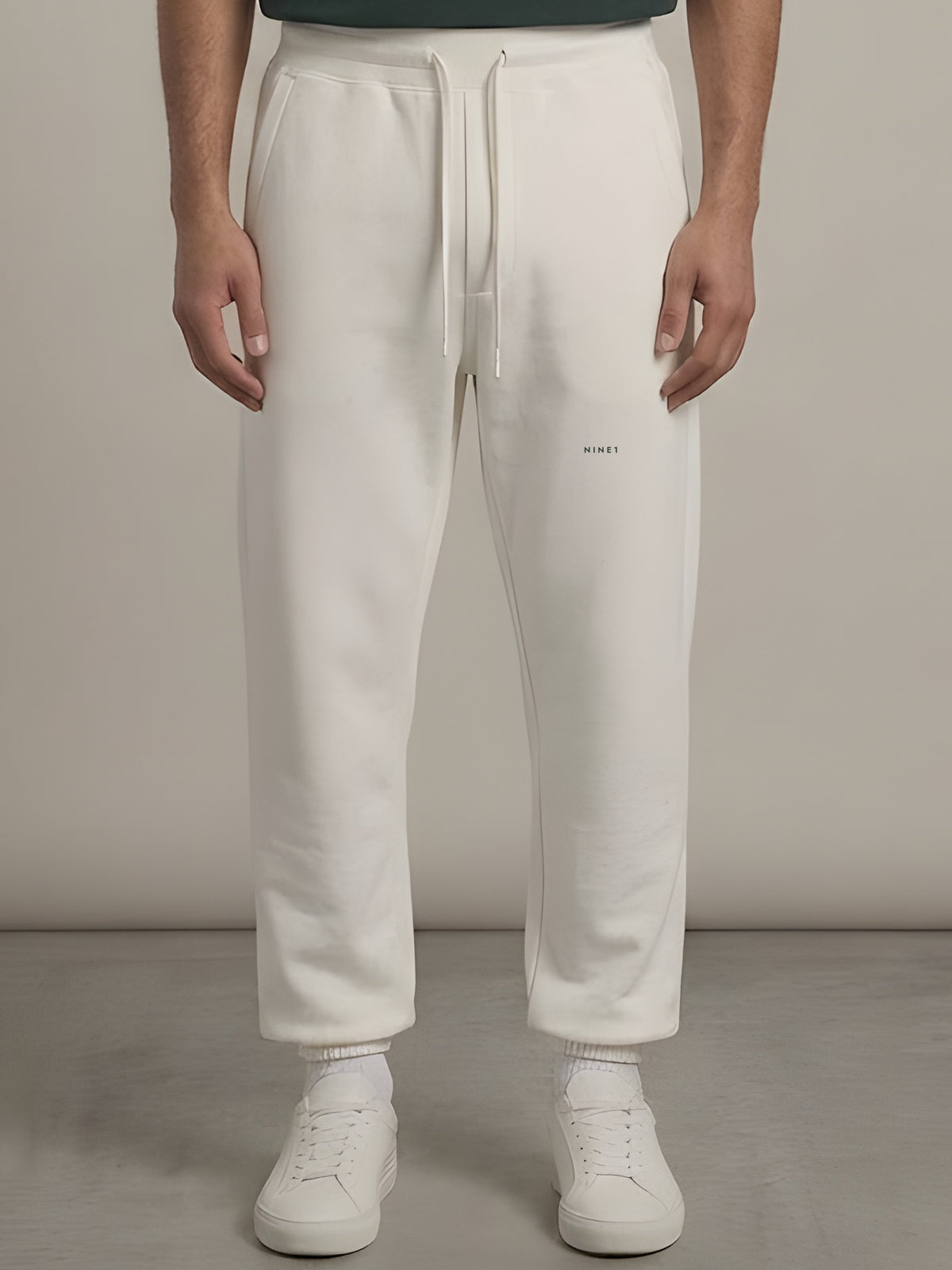 Gallery Open-Hem Jogger in Off White, N1J21, NINE1 micro wordmark at the leg