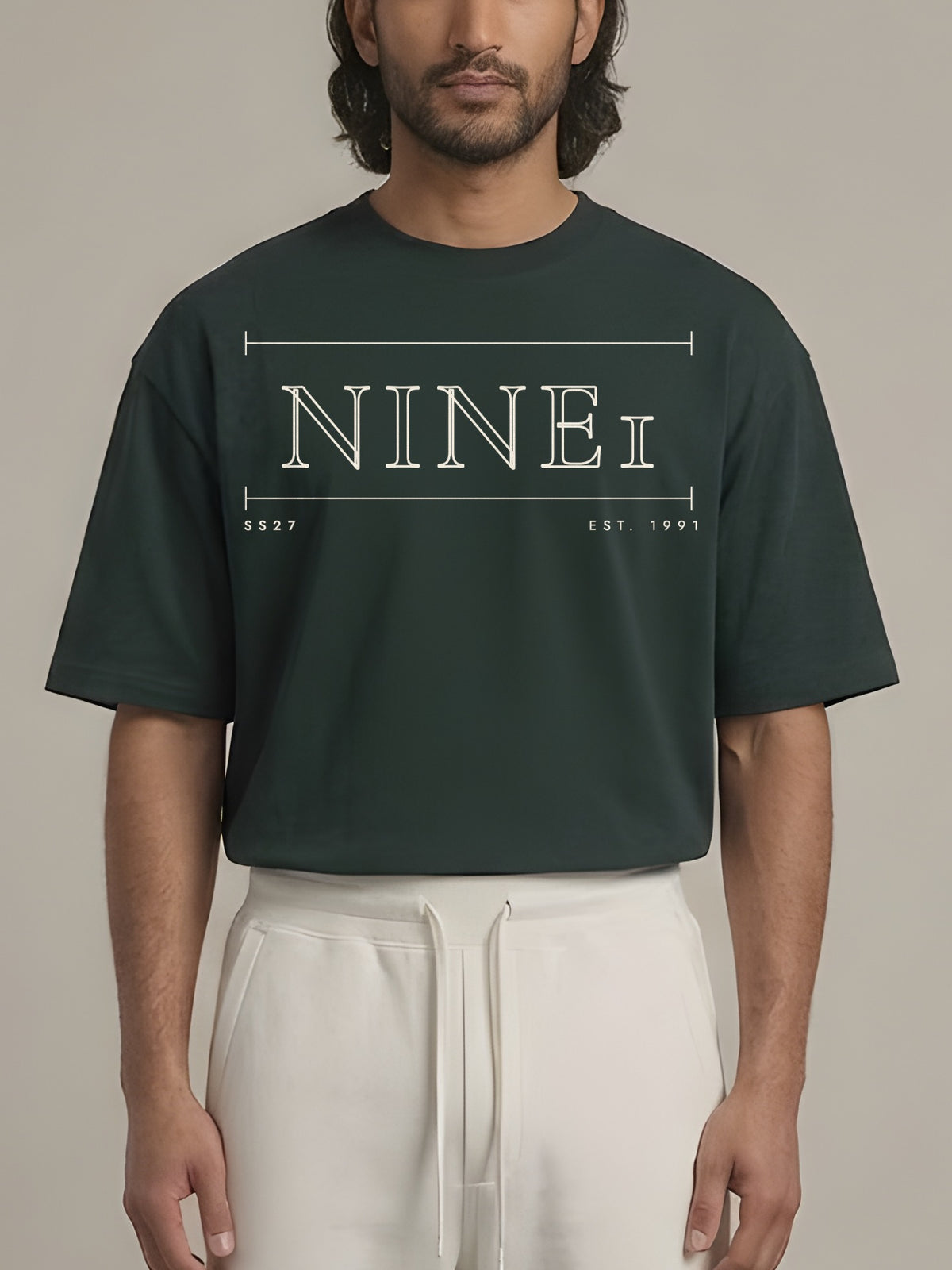 Gallery Oversized Tee in Dark Green, N1T21, wide cream outline NINE1 wordmark across the chest