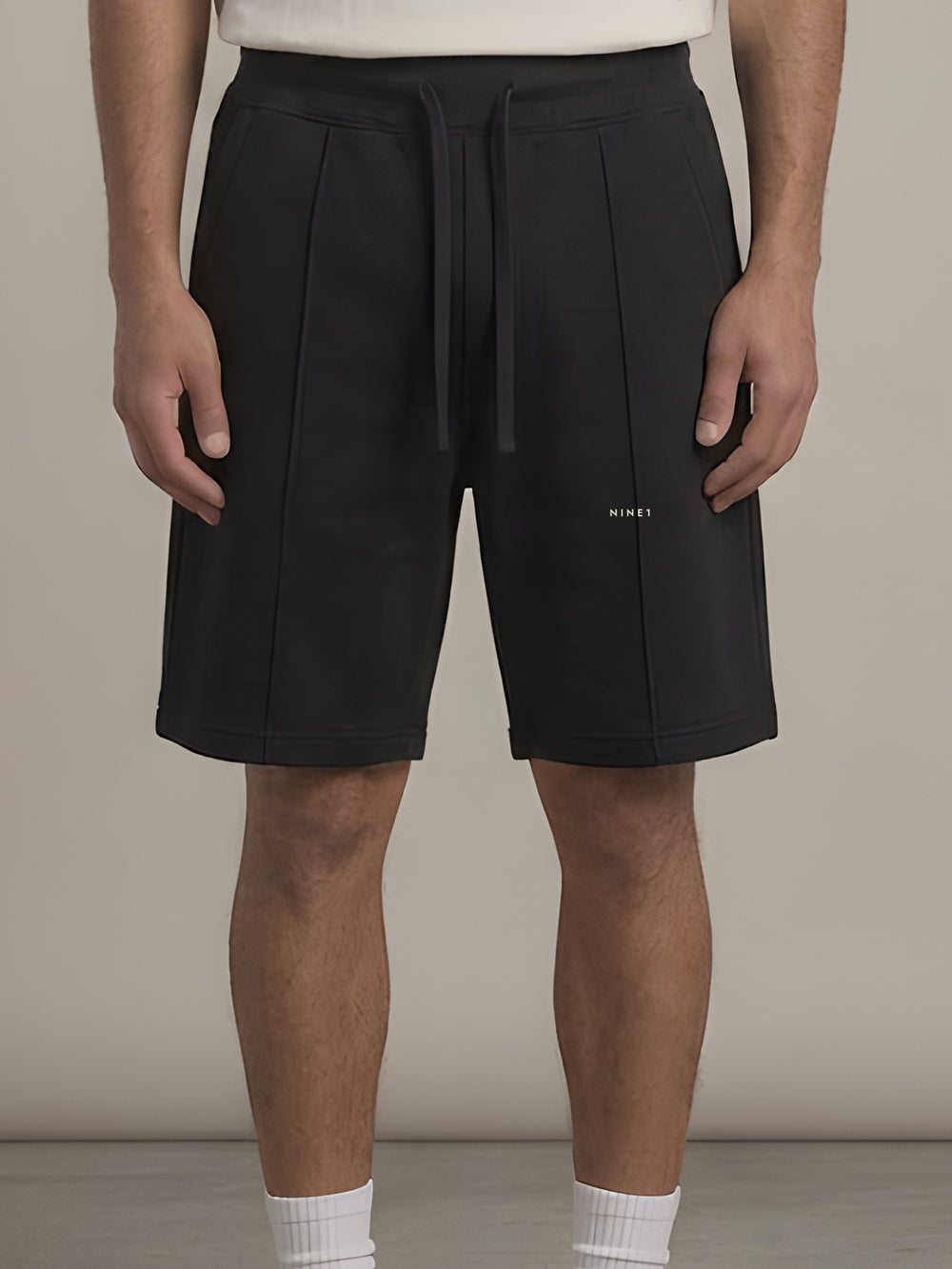 Column Shorts in Black, N1S22, NINE1 micro wordmark at the leg