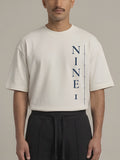 Column Oversized Tee in Off White, N1T22, tall navy NINE1 column printed down the left front